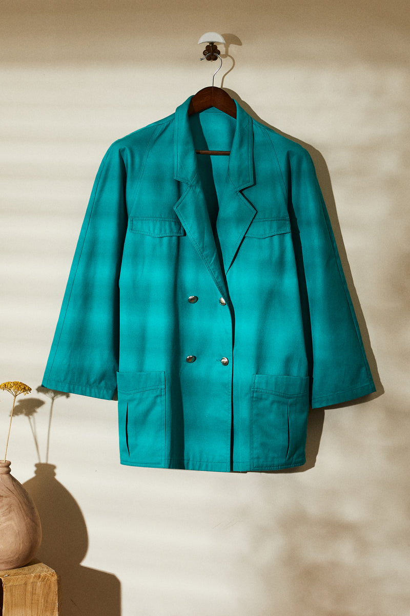 Mid-length green denim jacket