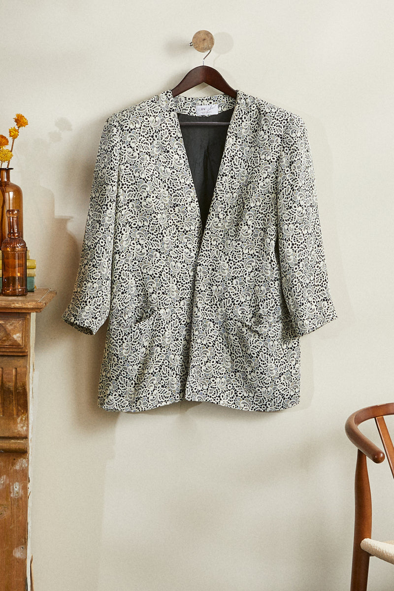 Straight jacket with iridescent patterns