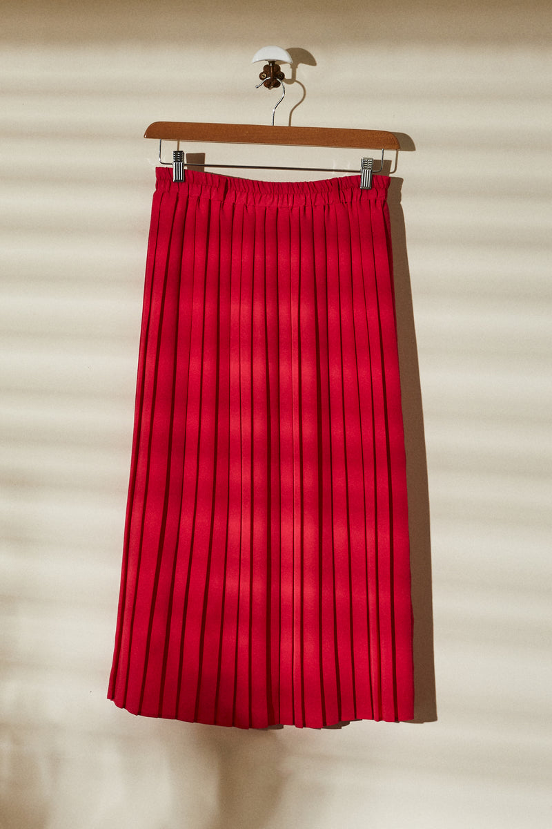 Long red pleated skirt