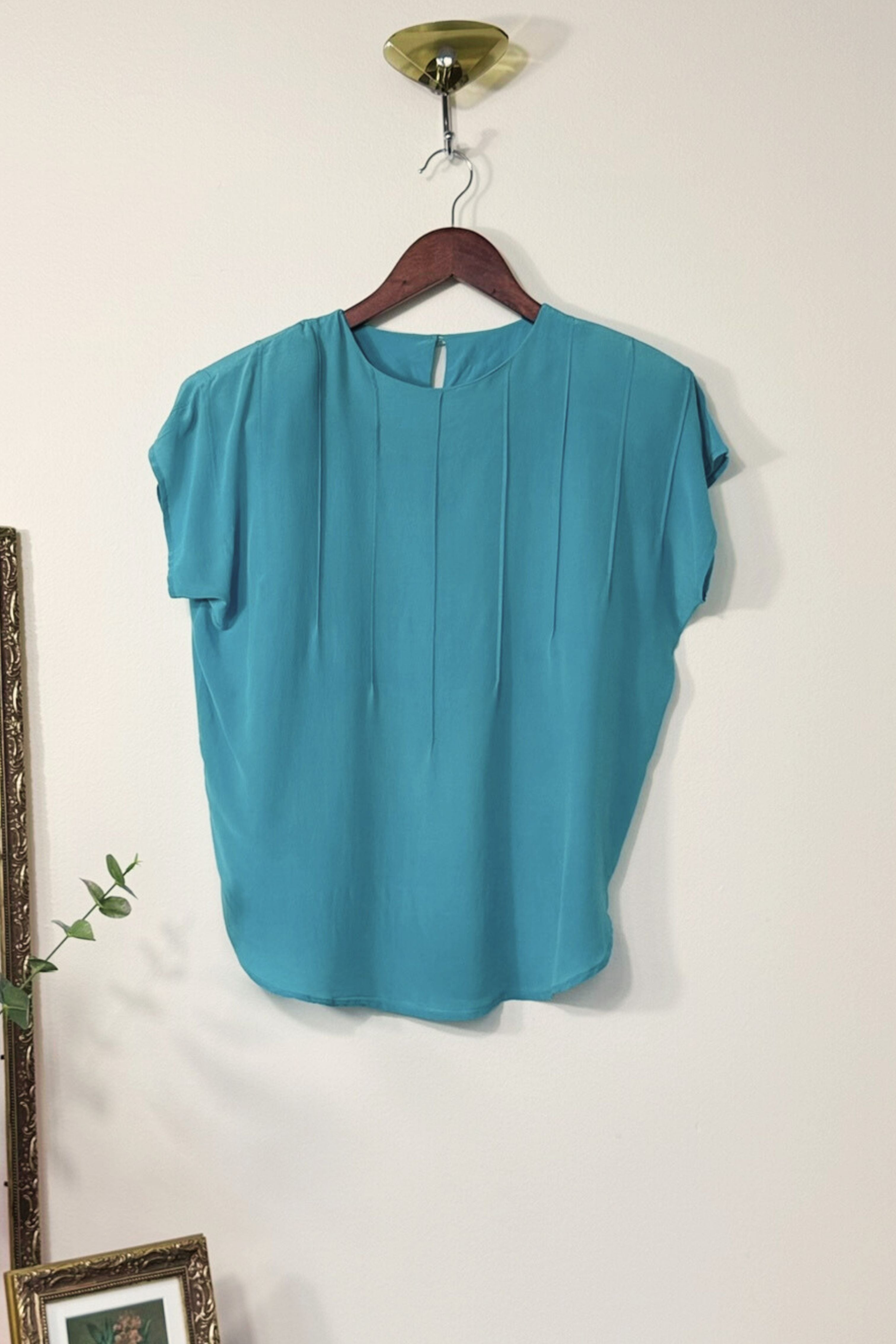 Blouse surpiquée en soie turquoise