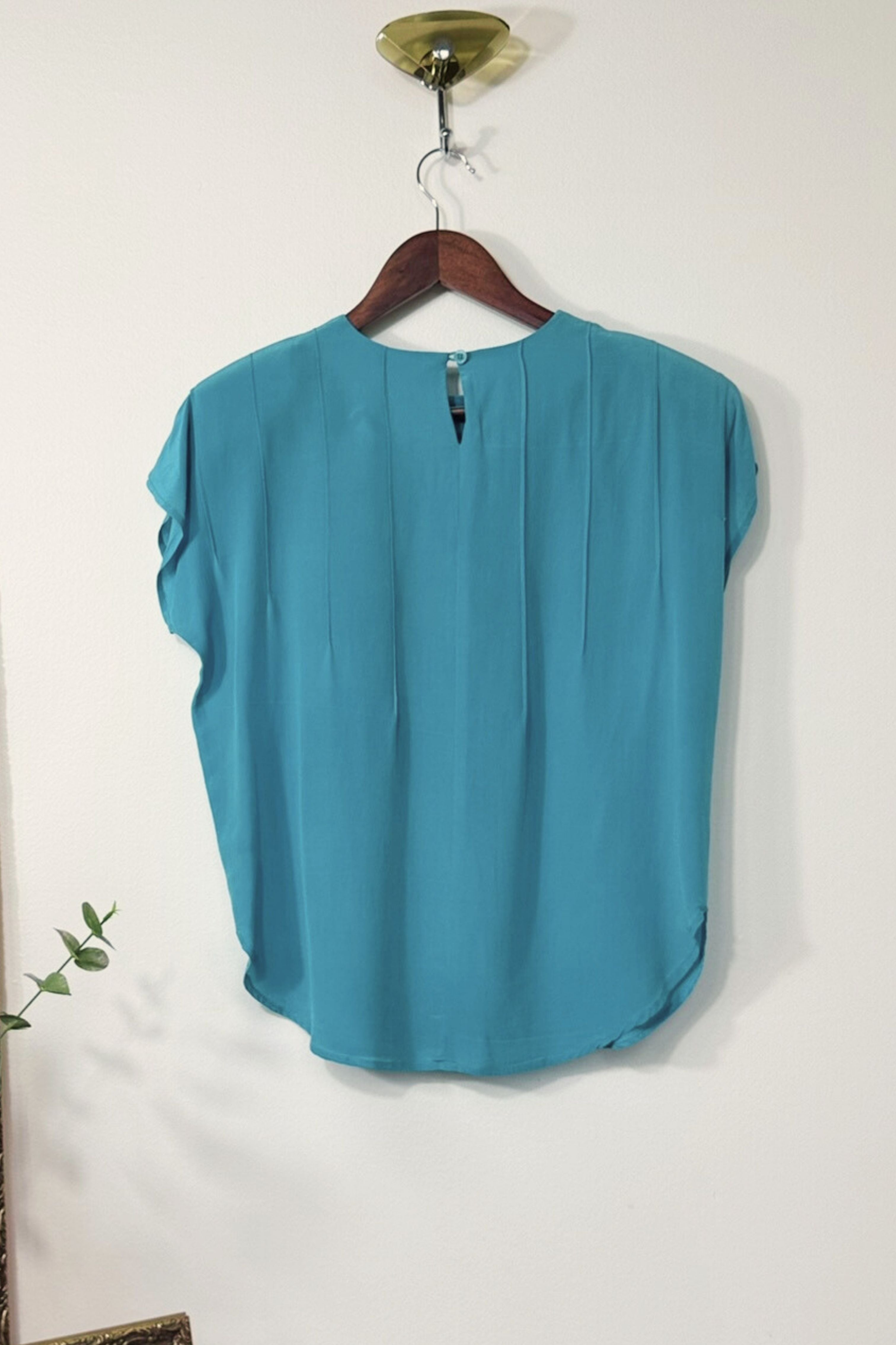 Blouse surpiquée en soie turquoise