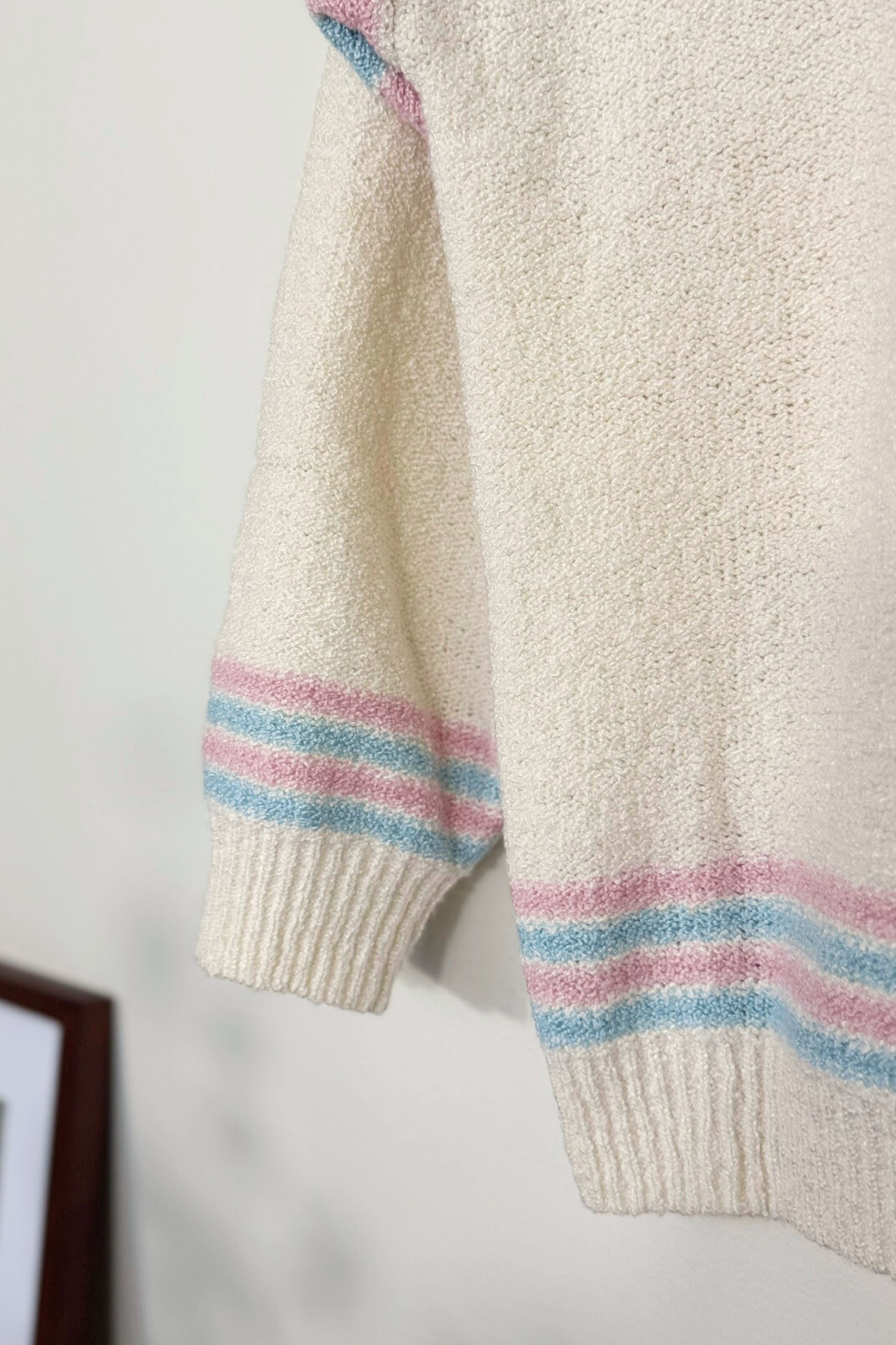 Pull écru en maille bouclée