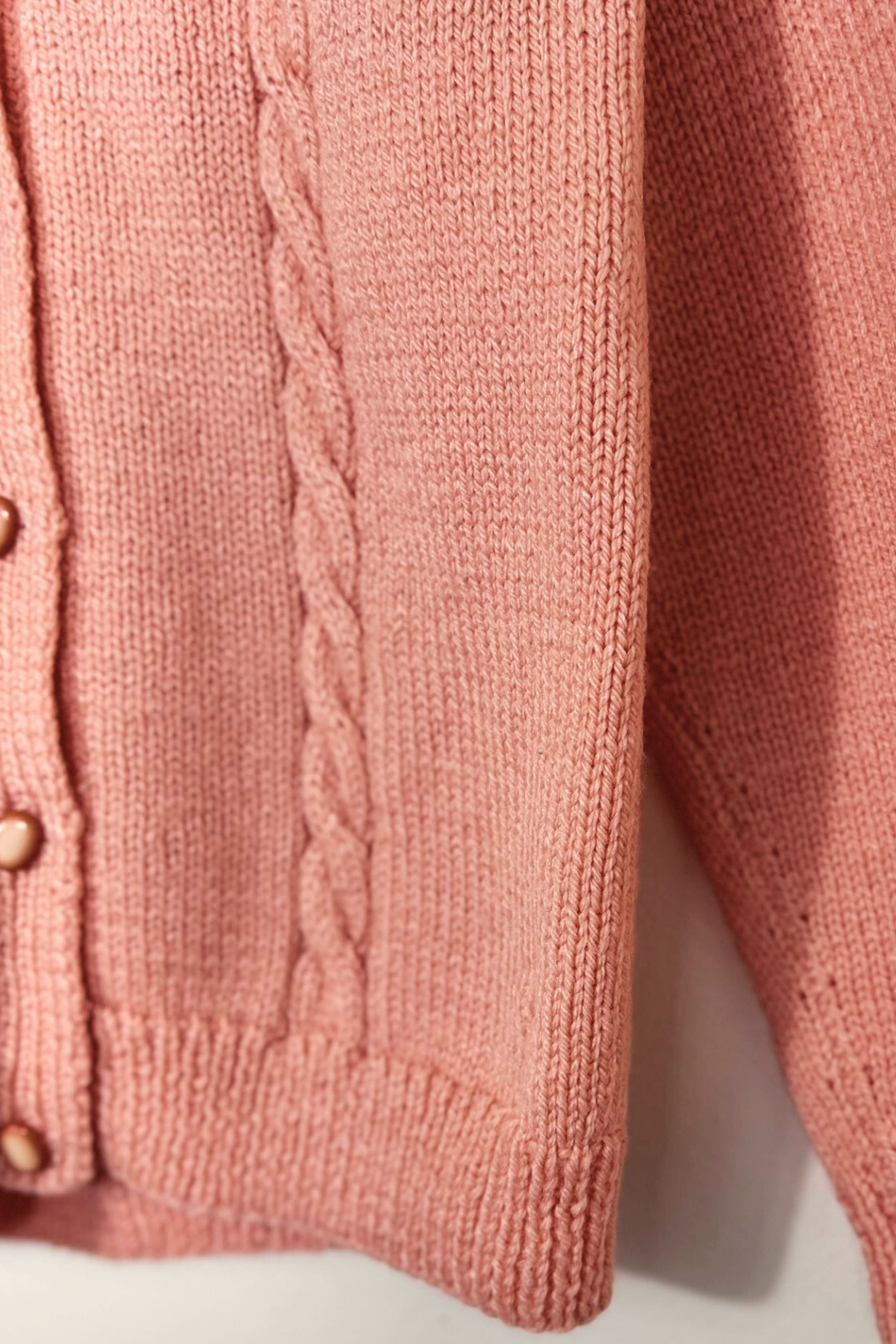 Gilet en maille tressée coton rose